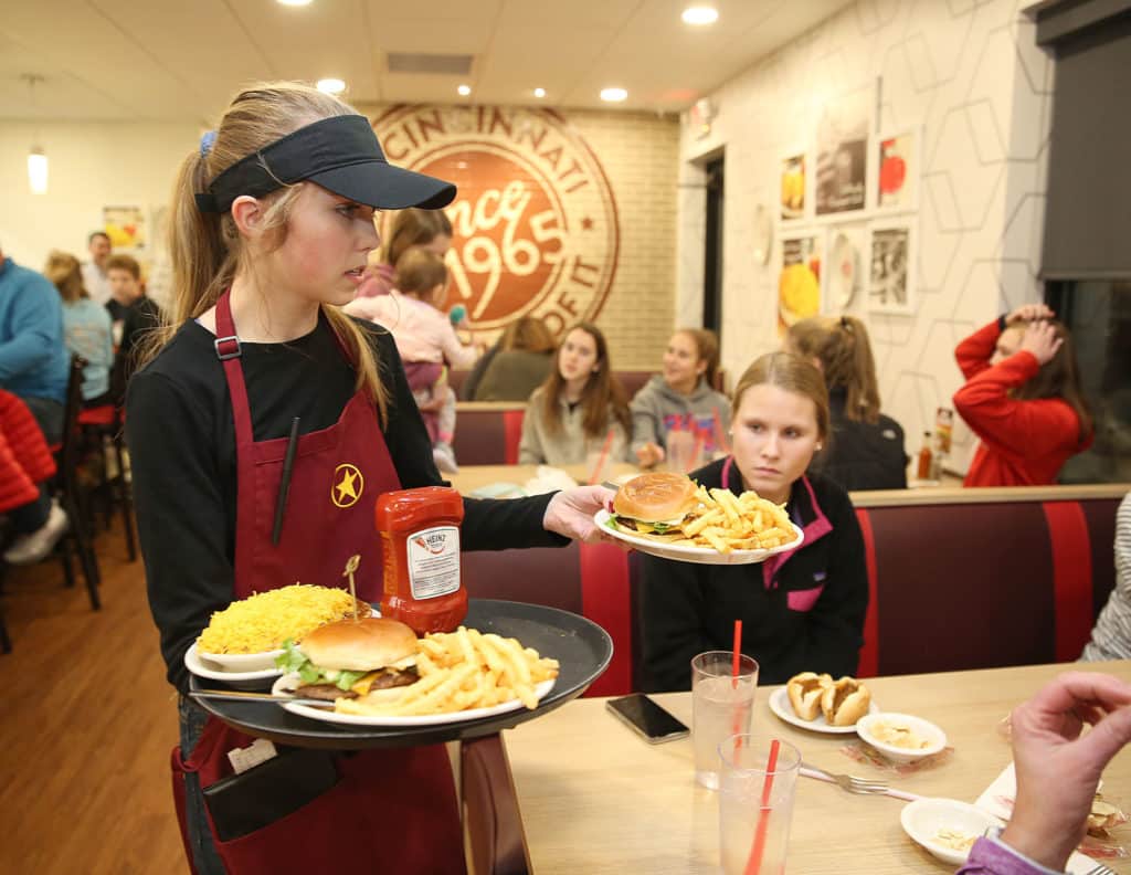 Gold Star Chili franchise waitress serves food to customers