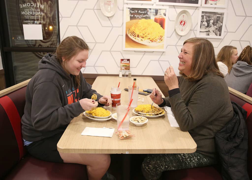 family enjoys their meal at Gold Star Chili franchise