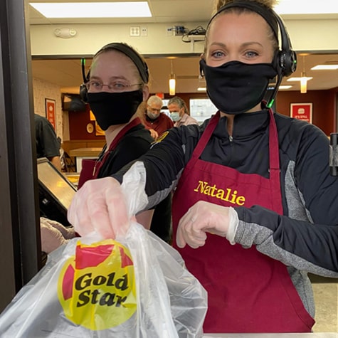 Gold Star Chili employees practicing social distancing while working the drive-thru